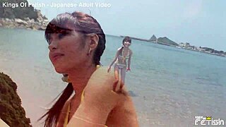 Skinny Japanese beach bikini girl poses tits out for close-up shoot!