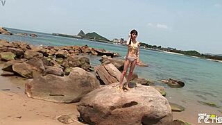 Skinny Japanese beach bikini girl poses tits out for close-up shoot!