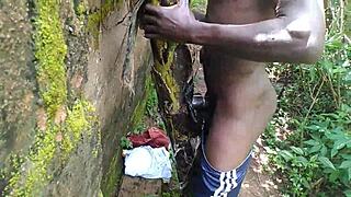 Oiled young babe teases nature with garden plantain play