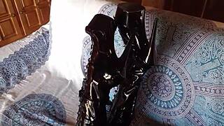 damn she's rockin' total black latex with fishnets pantyhose and knee boots