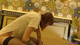 i spot this skinny redhead's tight shaved pussy peeking out braless on the bed in stockings