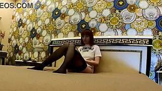 i spot this skinny redhead's tight shaved pussy peeking out braless on the bed in stockings