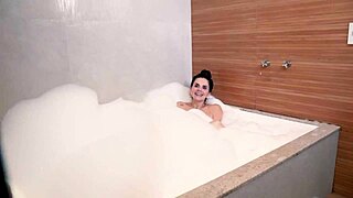 I'm quivering as this busty brazilian beauty and her lover double-team my soaked pussy in the tub