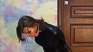 Bound crossdresser gagged in armbinder awaits fate?