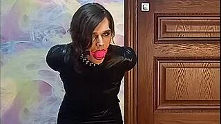 Bound crossdresser gagged in armbinder awaits fate?