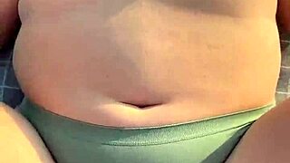 Big ass girl bends over for beach fun.