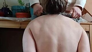 European female slave endures intense BDSM spanking session with facial cumshot