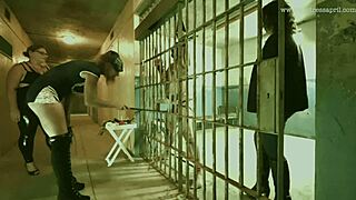 Dominatrix April interrogates bound slave in military camp