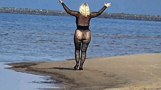 Isn't black babe flashing big ass on beach?