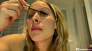 The mom next door strips teasing her big fake tits slowly