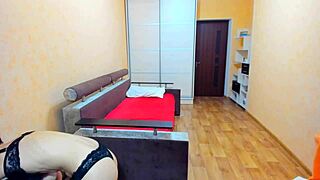 Tied tight in black bra and panties while sucking hard nipples