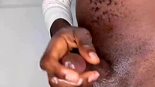 Ninja man grips his throbbing monster black cock before erupting cum.