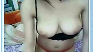 check out this busty asian amateur shaking her huge tits solo