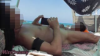 a exhibitionist wife gives outdoor handjob to big cock on nude beach for voyeurs misscreamy