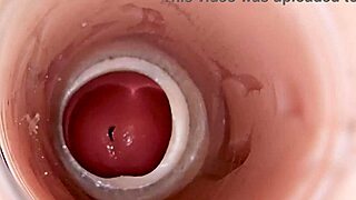 Camera positioned deep inside captures massive sperm release in vivid detail. Footage shows internal view of fluid expulsion.