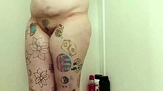 amateur curvy big tits tattooed babe soaps up dripping wet pussy and ass shaking