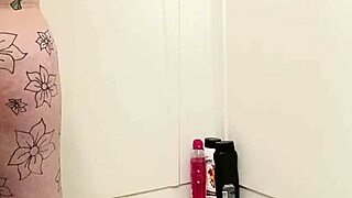 amateur curvy big tits tattooed babe soaps up dripping wet pussy and ass shaking