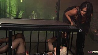 two lascivious lesbos strap on in dungeon for bdsm-style PUSSY licking and fucking