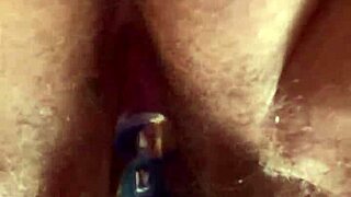 hairy pussy slowly takes glass dildo deep up close