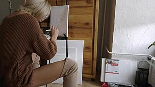Blonde babe in boots and glasses paints her pretty pussy flower closeup