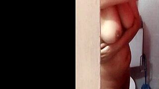 colombian big tits babe caught spying in shower, watch her huge boobs
