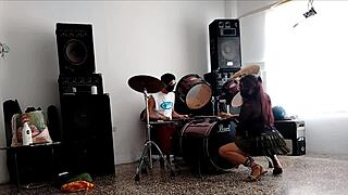 They drum while she dances, stripping her clothes and shaking that big curvy ass.