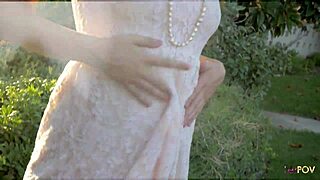 brunette and tattooed girl share intimate outdoor kisses and touches