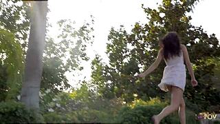 brunette and tattooed girl share intimate outdoor kisses and touches