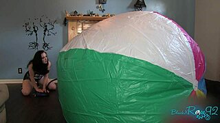 mega BEACH BALL inflation backstage with huge brunette milf