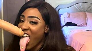 lexi butterfly slurps and spits on wall-mounted cock deeply