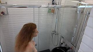 Stepdaughter sneaks fingering her shaved pussy in shower cam