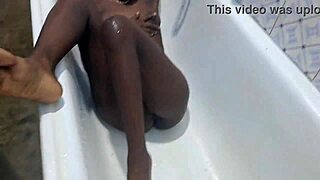 woman fingers herself to massive squirting orgasm in bathroom after workout