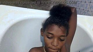 woman fingers herself to massive squirting orgasm in bathroom after workout