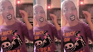 Blonde with glasses brushes her long hair sensually with lollipop in asmr whispers