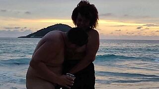 hotwife strips on beach for muscular stud's creampie pounding outdoors