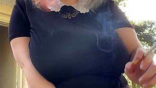 that alt milf neighbor lights up a smoke while flashing her huge natural tits out back