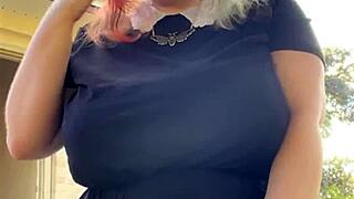 that alt milf neighbor lights up a smoke while flashing her huge natural tits out back