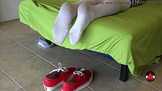 blonde dangles feet sneaker to socks