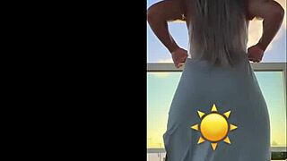 hot blonde dances sexy in see-through dress teasing her curves