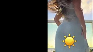 hot blonde dances sexy in see-through dress teasing her curves
