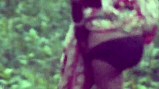 desi lady squats low to piss in steamy close-up view