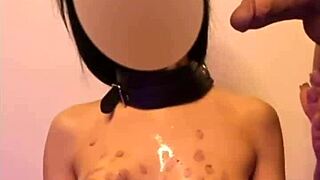 master drips hot candle wax on submissive redhead's skin during intense roleplay session.