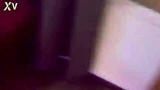 in the dimly lit room, she locks handcuffs for intense bdsm games and submission