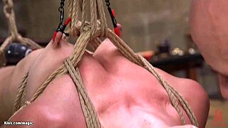hairy blonde endures whipping pain while bound in suspension bondage