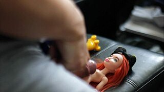 Tied Batgirl Doll Drowns in Sticky Cum Shower