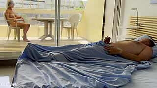 Naked wife watches nudists as husband wakes