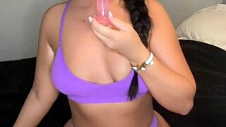 british student plays with toys on webcam