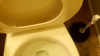 21 year old taking a piss in the toilet with a bit of penis showing