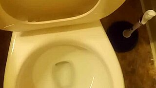 21 year old taking a piss in the toilet with a bit of penis showing