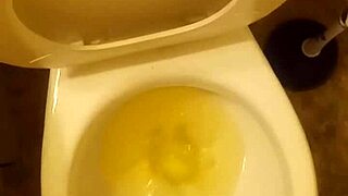 21 year old taking a piss in the toilet with a bit of penis showing